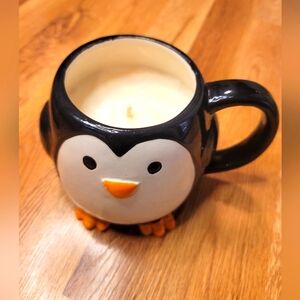 Penguin soy candle in coffee mug